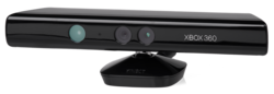 A long, black plastic tube with a stand on its bottom and sensors arrayed along its front. The Xbox 360 brand is displayed next to the sensors.