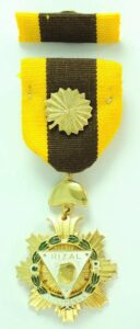 Regalia of a KOR is a ribbon with a golden anahaw rosette