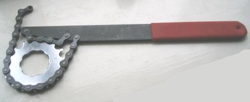 A chain whip tool, wrapped around a sprocket.
