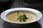 Carrot soup with a parsley garnish