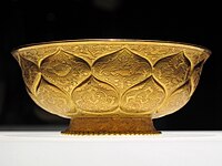 Tang era gilt-gold bowl with lotus and animal motifs