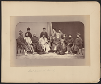 Dōst Moḥammad Khan seated slightly to the right of center in this photograph. To Dōst Moḥammad's right, the first figure in a white chapan (overcoat) is his son and successor Sher ʻAlī Khān (1825–1879), who ruled Afghanistan from 1863 to 1879. Abd al-Raḥmān Khān (c. 1844 – 1901), the grandson of Dōst Mohammad and future "Iron Amir" of Afghanistan, is on Dōst Moḥammad's far left. Photograph by John Burke.