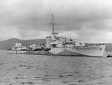 a black-and-white photograph of a warship at sea