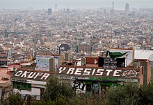 Roof of squat, painted with the slogan "occupy and resist"