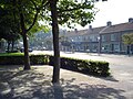 The village centre, housing stores, the post office, medical centre, church, fuel station, a FIAT dealer and the bus station.