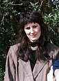 Young woman in Europe wearing a jacket with shoulder pads, 1985.