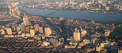 A cityscape including a number of skyscrapers, with a river running through the middle