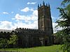 Stone building with prominent square tower.