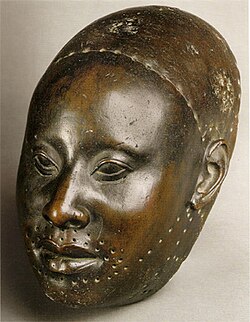 Mask for Obalufon II; circa 1300 AD; copper; height: 29.2 cm; discovered at Ife; Ife Museum of Antiquities (Ife, Nigeria)[54]