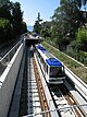 A Lausanne Métro train emerges from underground.