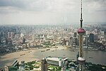 A view from the Jin Mao Tower's Skywalk, showing the Oriental Pearl Tower in Lujiazui and, across the Huangpu River, Shanghai's Bund, Nanjing Road, and the Garden Bridge across Suzhou Creek