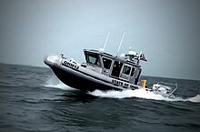 Defender-class boat with the Ohio Naval Militia in the water.