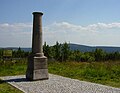 meridian fixed point from 1864 in foreground, Klínovec in background