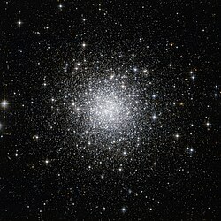 Thousands of white-ish dots scattered on a black background, strongly concentrated towards the center