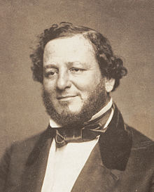 A black-and-white photo of Benjamin wearing a suit