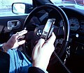 Image 57A New York City driver holding two phones (from Smartphone)