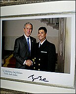 President George W. Bush congratulates Navy Chaplain, Imam Abuhena Saifulislam, the first U.S. Navy Muslim chaplain assigned to the Marine Corps