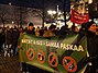 A pro-migration demonstration in Helsinki, Finland, showing a sign saying Natsit & ISIS = samaa paskaa, Finnish for "Nazis & ISIS = the same shit".