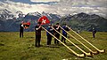 Image 19Some of the traditional symbols of Switzerland: the Swiss flag, the alphorn and the snow-capped Alps (from Culture of Switzerland)