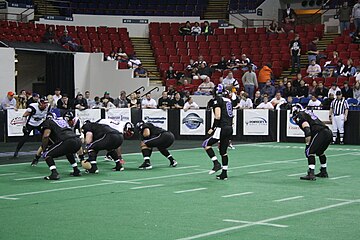 Quarterback Ryan Maiuri taking a snap against the Chicago Slaughter on March 21, 2008.