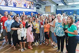 First Lady Jill Biden posing for a photo with Maui wildfire survivors on August 21, 2023