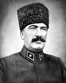 Older, soldier with a moustache wearing a fez