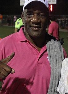 Billy Sims with one finger up, posing for a picture.