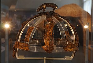 Colour photograph of the Benty Grange helmet, which has a freestanding boar atop its crest