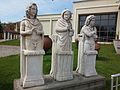 Statues depicting the seasons summer, winter and fall (from left to right)