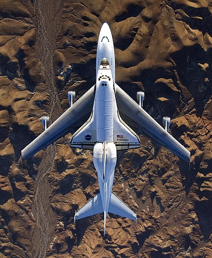 #5: NASA's modified Boeing 747 Shuttle Carrier Aircraft with the Space Shuttle Endeavour STS-126 on top flies over California's Mojave Desert on its way back to the Kennedy Space Center in Florida on Dec 10, 2008. Attribution: NASA - Photo by Carla Thomas. (public domain)