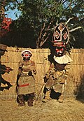 Image 26Makishi dancer, found in North-Western Zambia, represent spirits of a deceased who returns to assist the living (from History of Zambia)