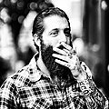 Image 140A man with sleeve tattoos, beard and flannel shirt, mid 2010s (from 2010s in fashion)