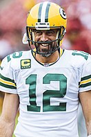 Portrait photo of Aaron Rodgers smiling in uniform