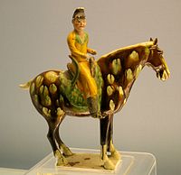 A Tang sancai glazed tomb figure an equestrian figure on a horse