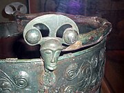 A copper head on the Aylesford bucket, British Museum.[4]: 119 