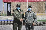 Chinese Minister of National Defence Wei Fenghe in Type 19 office uniform (right)