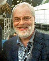 Ron Clements smiling at a festival