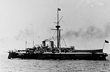 a black and white image of a ship underway