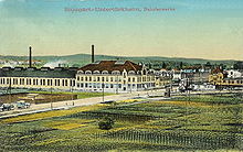 A colourised postcard showing a German factory visited by the Windsors