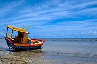 Boat on beach in Japaratinga