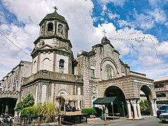 Church bell tower and portico in December 2023