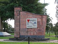 This memorial in Blievenstorf of the death march from Sachsenhausen concentration camp includes a red triangle emblem