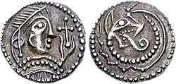 Anglo-Saxon silver sceat, Kent, c. 720. Diademed head, holding cross; reverse, wolf-headed snake.