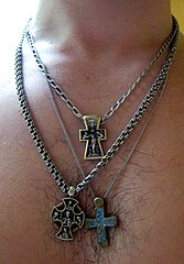 A man with three different cross necklaces