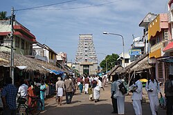 The Sannathi or Sannadi (temple enclosure street) of the Dharbaranyesvarar temple, with its gopuram in perspective.