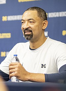 Headshot of Juwan Howard, a black middle-aged man with