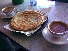 Paratha served with tea in a Pakistani hotel