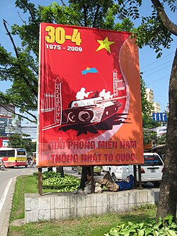A sign in Hanoi, 2009, depicting the moment a Viet Cong tank crashed into the Presidential Palace on 30 April 1975.