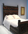 Bedstead (1880), ebonized cherry, veneer inlays, High Museum of Art