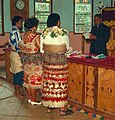 A just-married Tongan couple wearing their wedding taʻovala